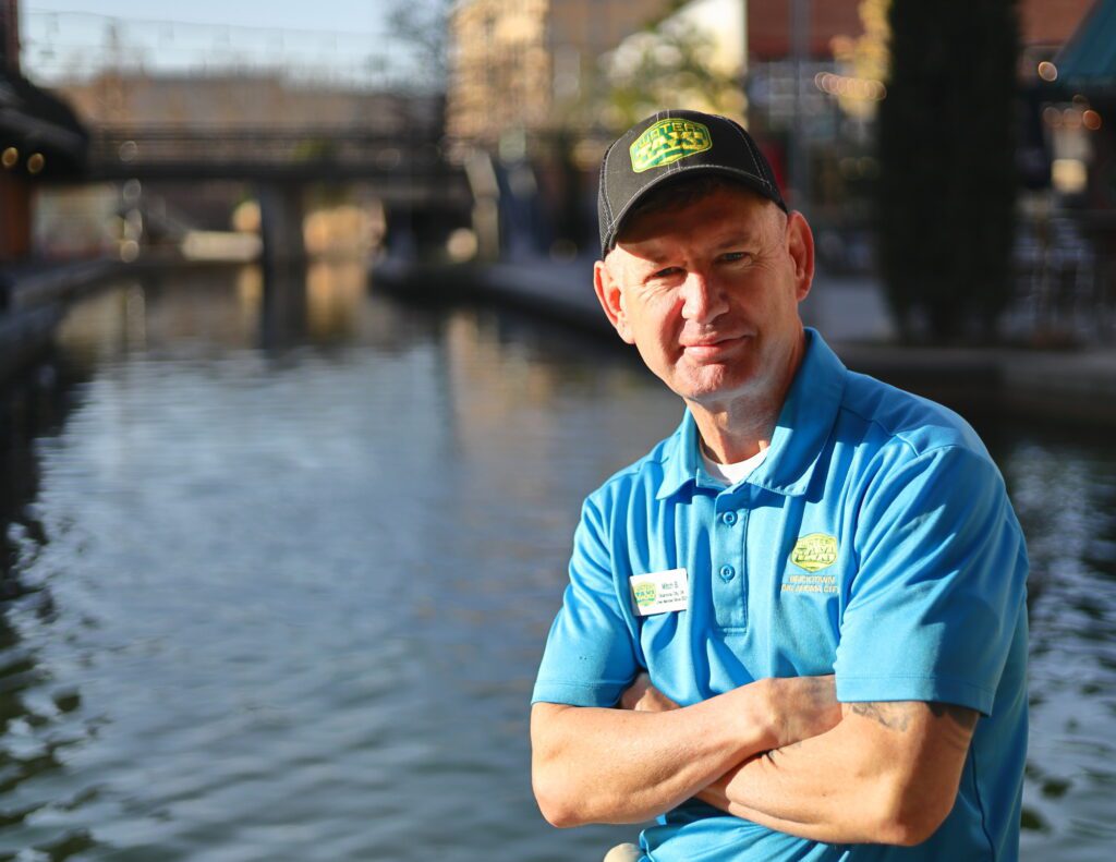 Water Taxi Ambassador Mitch Brown poses on the Bricktown Canal – photo by Pablo Angulo - Gonzalez